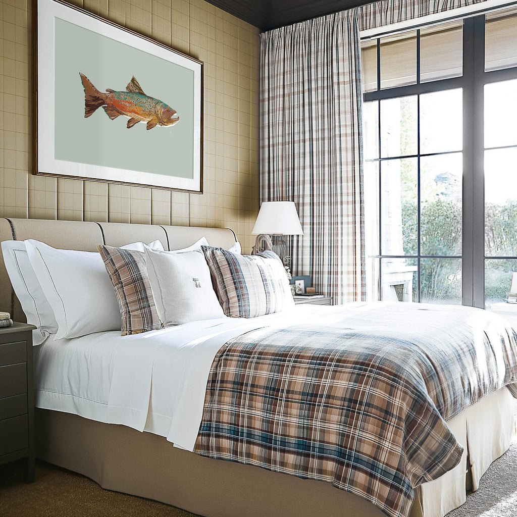 masculine bedroom in a luxury mountain house, there is a brown trout painting above the bed, and the bedding and curtains are neutral colored plaids