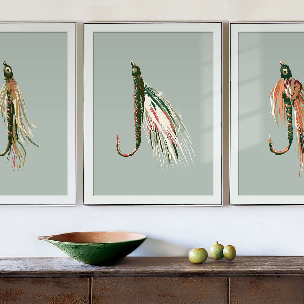 framed fishing fly art set above a rustic entryway table