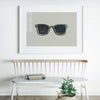 modern wayfarer sunglasses art print displayed over bench