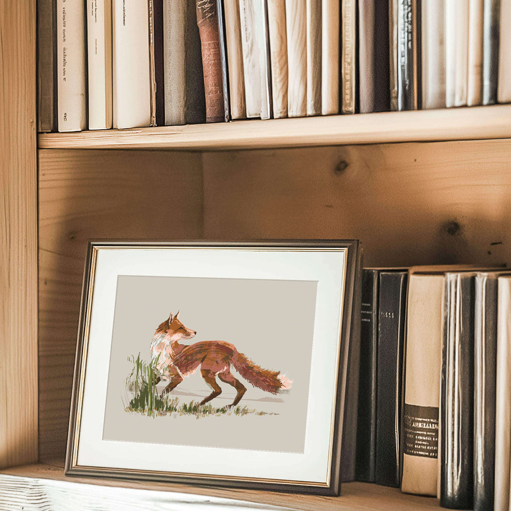 framed fox painting on a bookshelf in a naturalist's cabin, the image is a close up shot