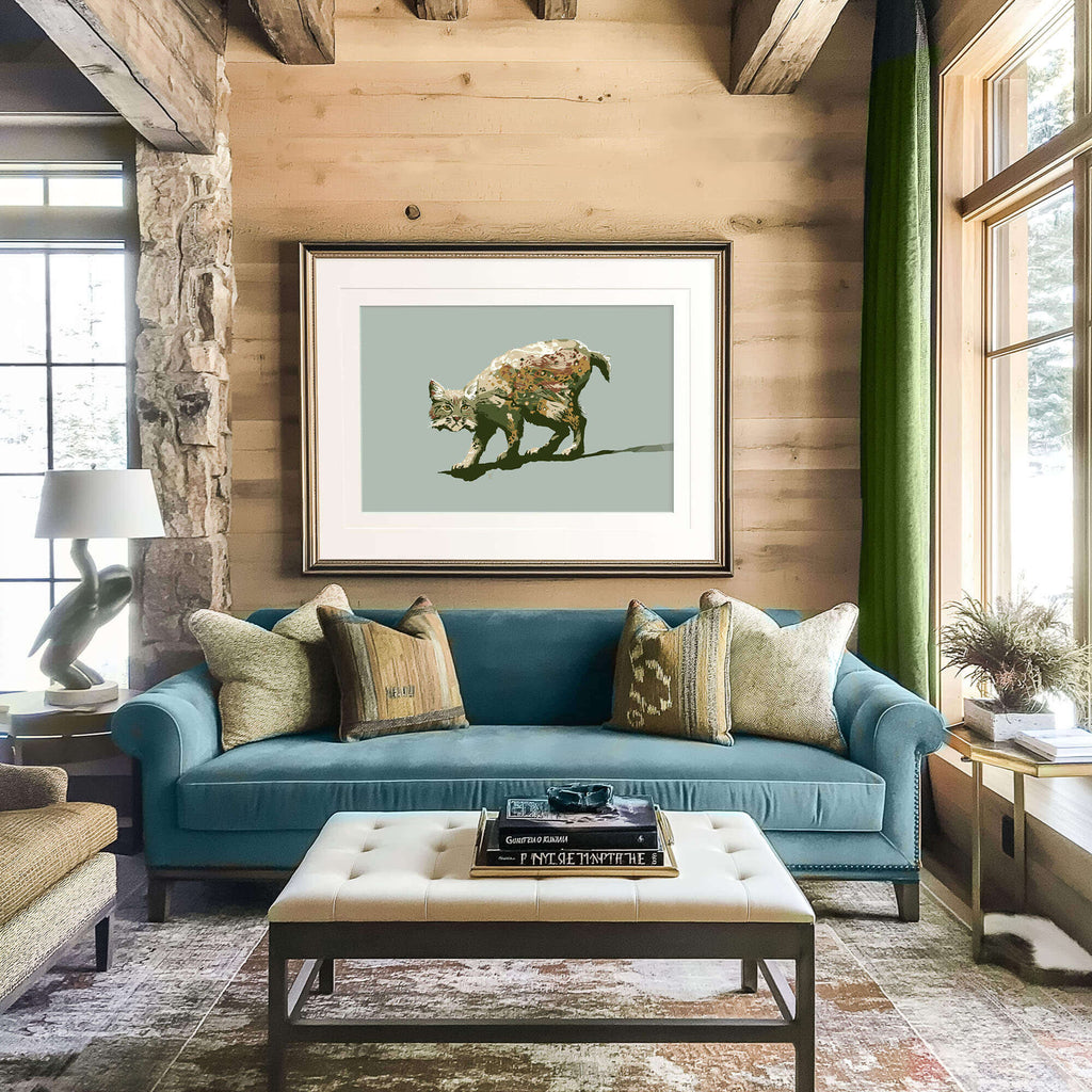 a rustic contemporary ski hotel lobby with a framed bobcat drawing over the blue sofa