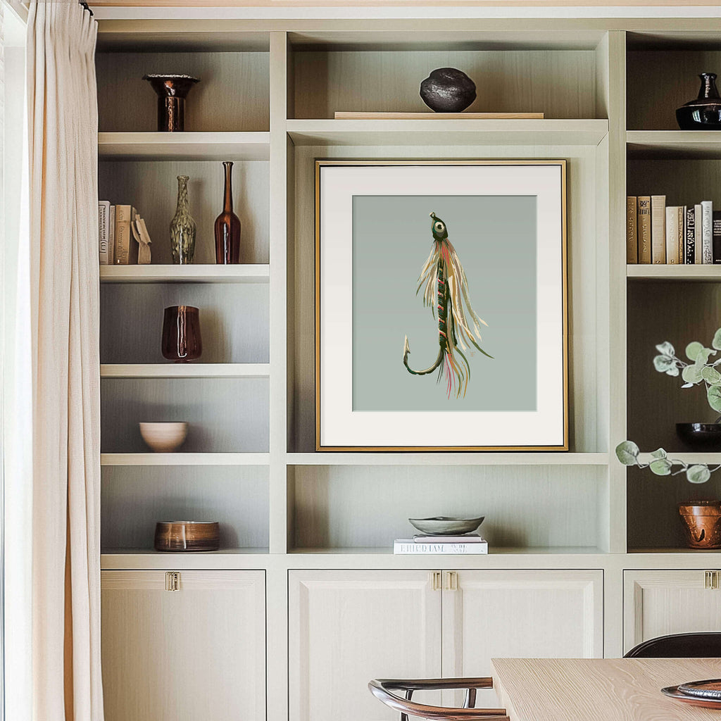 built in bookcase in the dining room of a high-end lake house, the decor is light grey wood, there is a framed fly fishing poster on the wall
